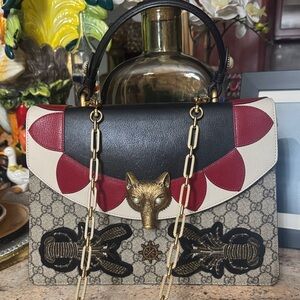 Gucci Black, Red, LOCKY two way Bag.
This is a well made piece.